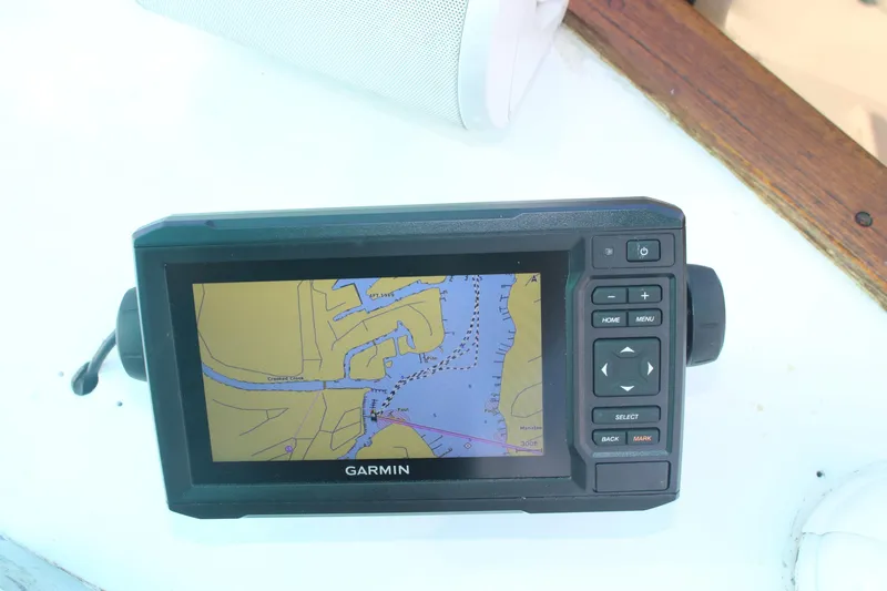 Slide: The Image of Garmin GPS device on 1974 Grand Banks 42 Classic boat, displaying nautical map. - 21