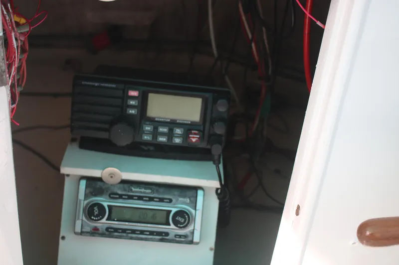Slide: The Image of Radio equipment inside a 1974 Grand Banks 42 Classic boat. - 25