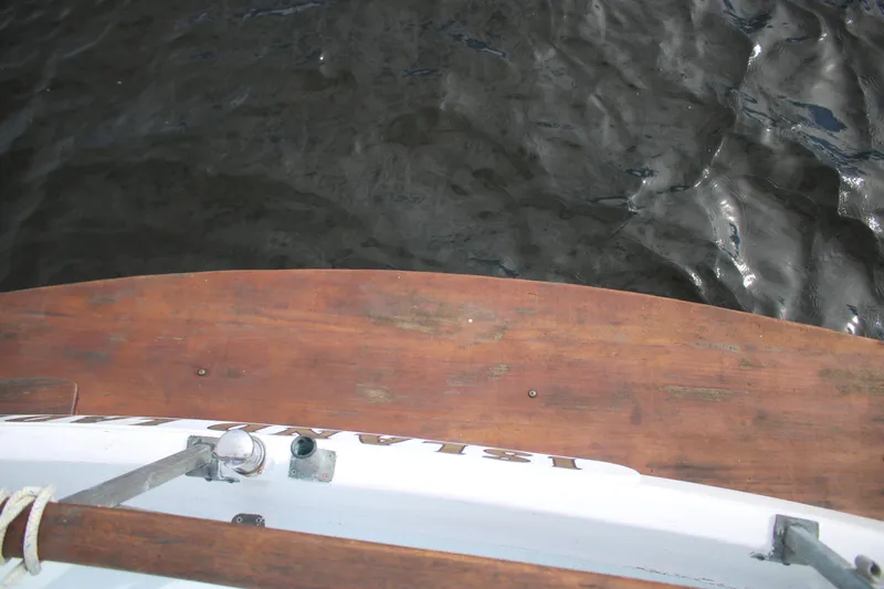 Slide: The Image of 1974 Grand Banks 42 Classic boat deck with wooden finish, overlooking water. - 6