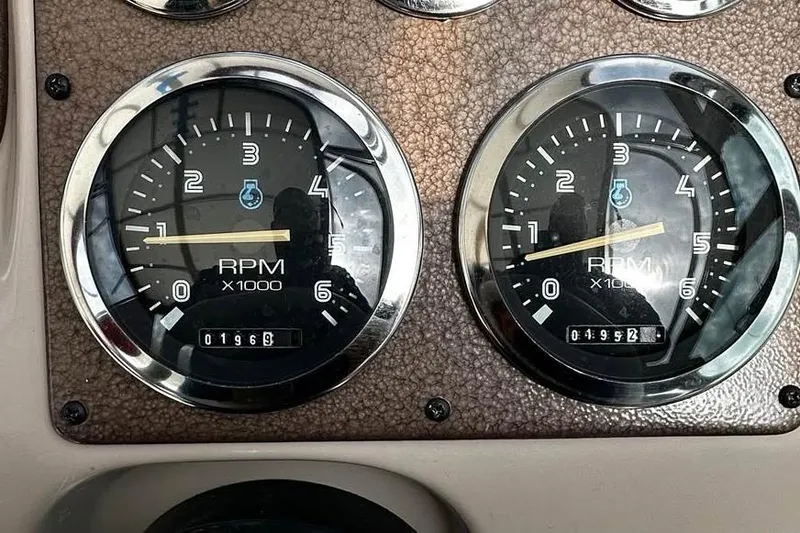 Slide: The Image of Dashboard of 1999 Chaparral Signature 29 showing RPM gauges. - 13