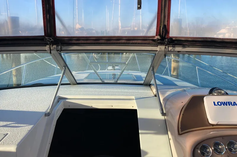 Slide: The Image of 1999 Chaparral Signature 29 boat interior with dashboard and windshield view. - 14