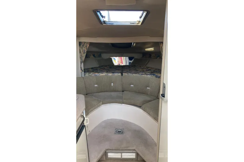 Slide: The Image of 1999 Chaparral Signature 29 cabin interior with seating and bedding area. - 16