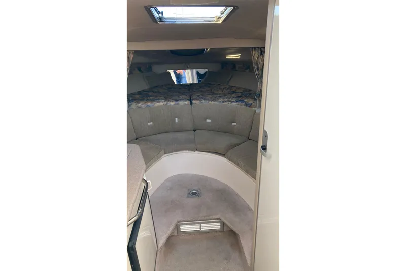 Slide: The Image of 1999 Chaparral Signature 29 cabin interior with seating and skylight. - 18
