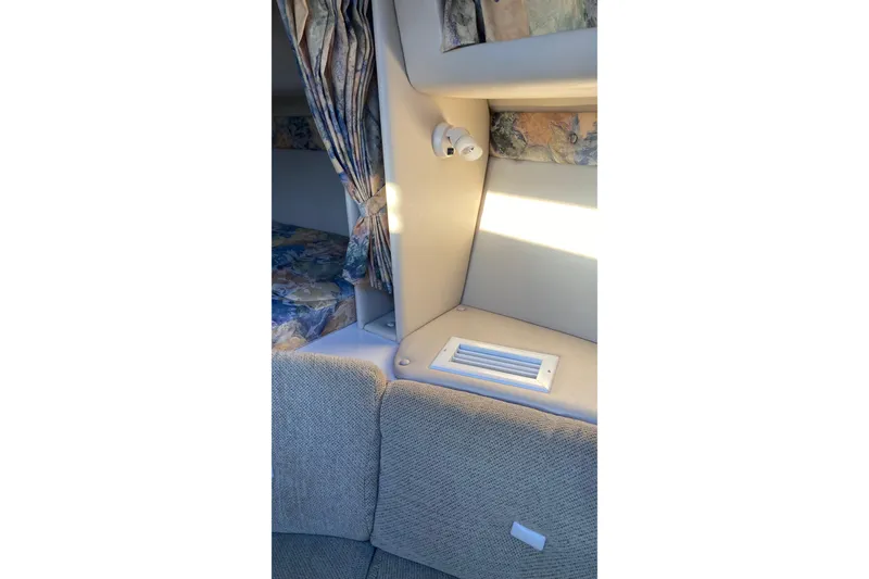 Slide: The Image of 1999 Chaparral Signature 29 interior with seating, curtains, and vent detail. - 21