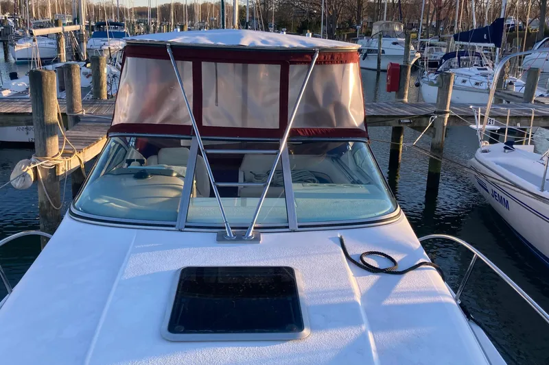 Slide: The Image of 1999 Chaparral Signature 29 boat docked at marina with canopy and clear windshield. - 47