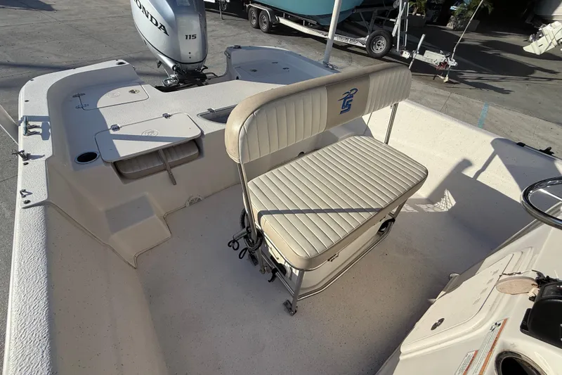 Slide: The Image of 2017 Carolina Skiff 218 boat interior with Honda 115 outboard motor. - 13
