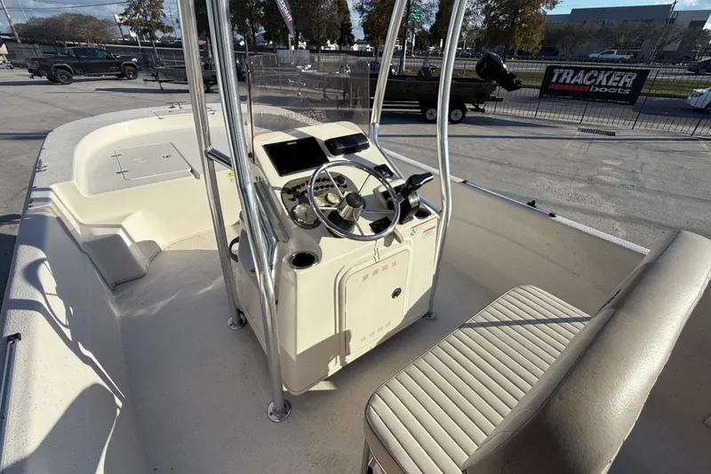 Slide: The Image of 2017 Carolina Skiff 218 boat interior with steering console and seating. - 9