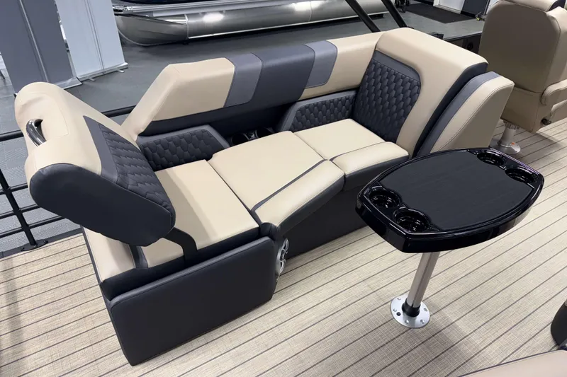 Slide: The Image of Luxurious seating and table on 2026 Sylvan L3 LZ pontoon boat, featuring modern design and comfort. - 16