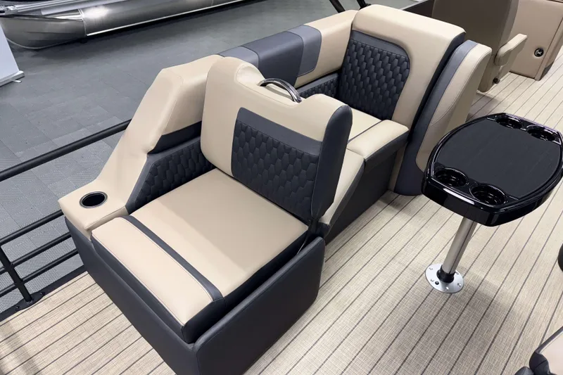 Slide: The Image of Luxurious seating on 2026 Sylvan L3 LZ pontoon boat with cup holders and table. - 17