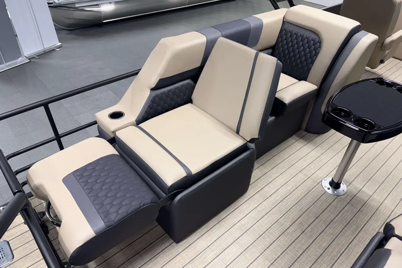 Slide: The Image of Luxurious seating on 2026 Sylvan L3 LZ boat with modern design and cup holders. - 18