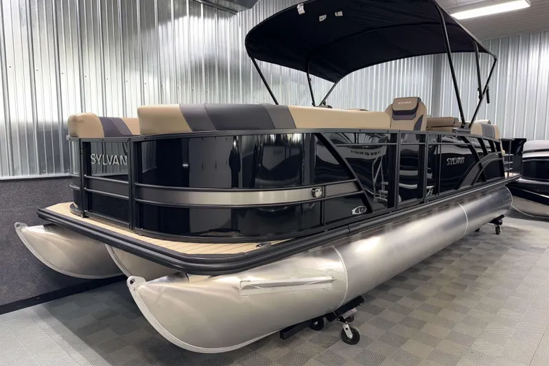 Slide: The Image of 2026 Sylvan L3 LZ pontoon boat in showroom, featuring sleek design and canopy. - 20