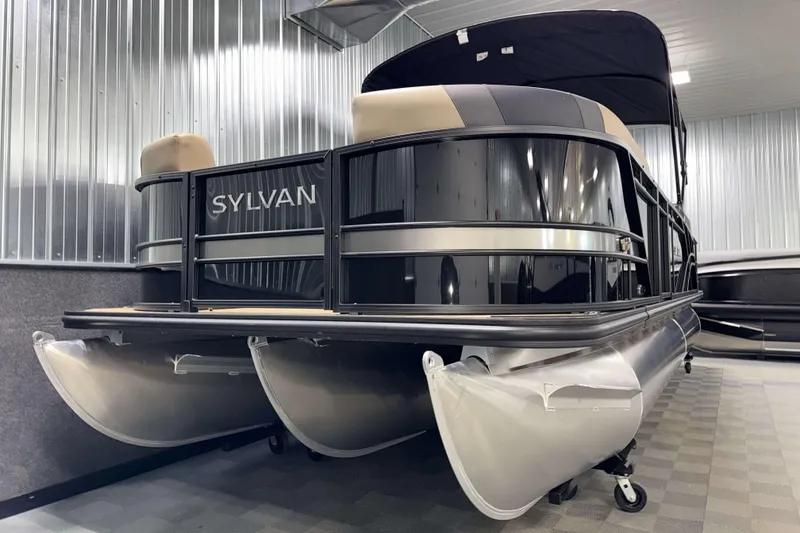 Slide: The Image of 2026 Sylvan L3 LZ pontoon boat in a showroom, showcasing sleek design. - 22