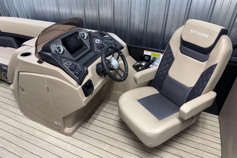 Slide: The Image of Captain's seat and console of 2026 Sylvan L3 LZ boat, featuring modern controls and design. - 8