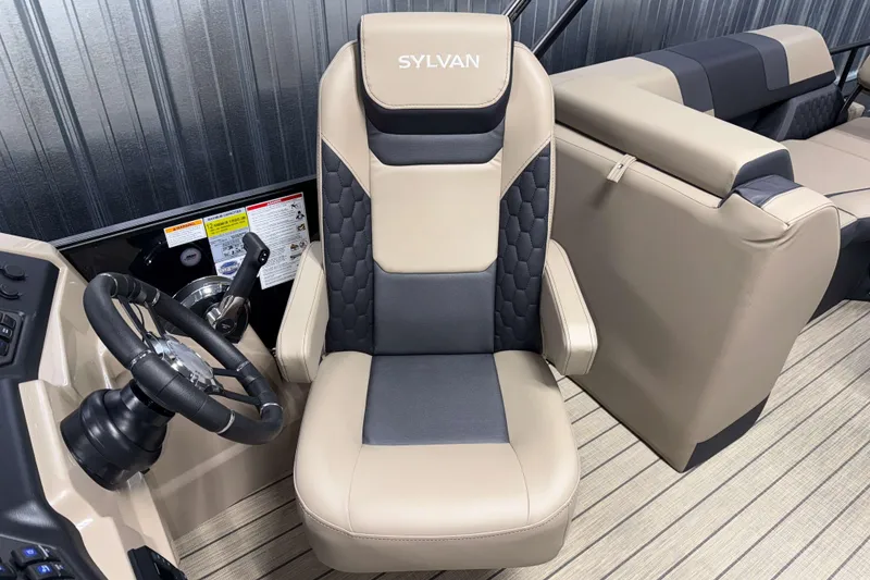 Slide: The Image of 2026 Sylvan L3 LZ boat interior with beige and black captain's chair. - 9