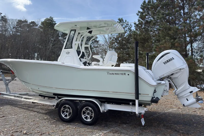 Slide: The Image of 2026 Tidewater 232 LXF boat on trailer with Yamaha engine, parked outdoors. - 5