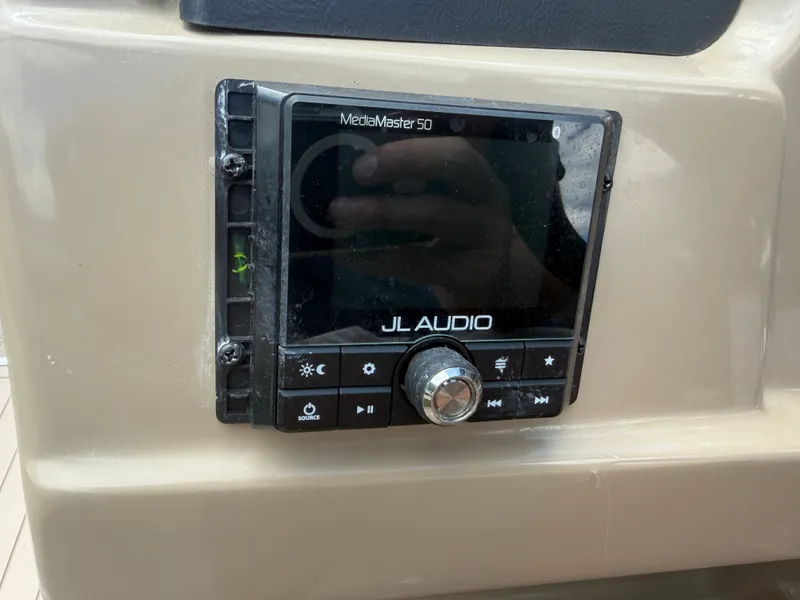 Slide: The Image of A JL Audio MediaMaster 50 control unit is installed in a boat. - 23