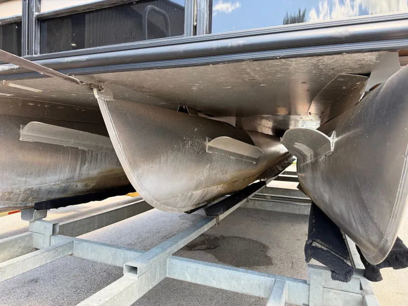 Slide: The Image of Underside view of a 2022 Sylvan L1 DLZTT pontoon boat on a trailer. - 9