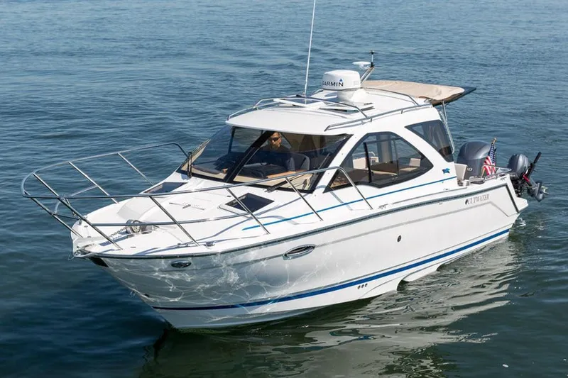The Image of 2016 Cutwater C-24 boat docked in a covered marina. - 0