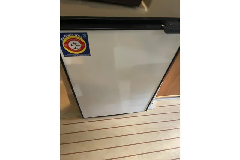 Slide: The Image of Outboard motor on a 2016 Cutwater C-24 boat, docked by the water. - 19