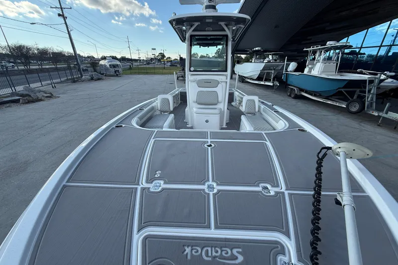 Slide: The Image of 2022 Caymas 28 HB Twin boat interior with quilted seating and spacious layout. - 11