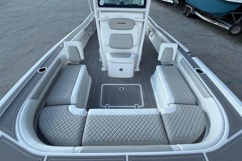 Slide: The Image of 2022 Caymas 28 HB Twin boat interior with dual Mercury engines and modern helm controls. - 12