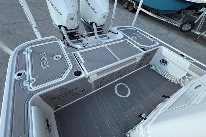 Slide: The Image of 2022 Caymas 28 HB Twin boat deck with seating and Mercury engines. - 15
