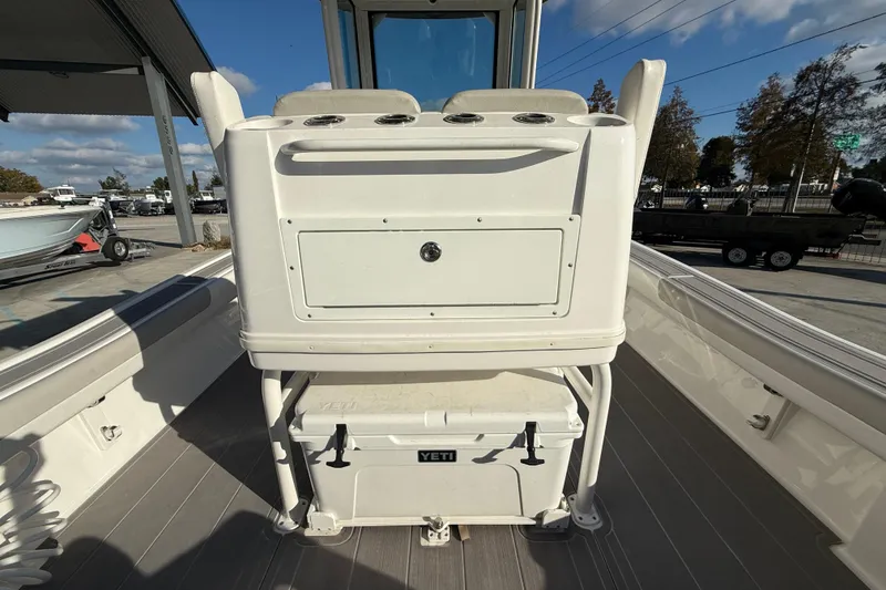 Slide: The Image of 2022 Caymas 28 HB Twin boat cockpit with modern controls and steering wheel. - 18