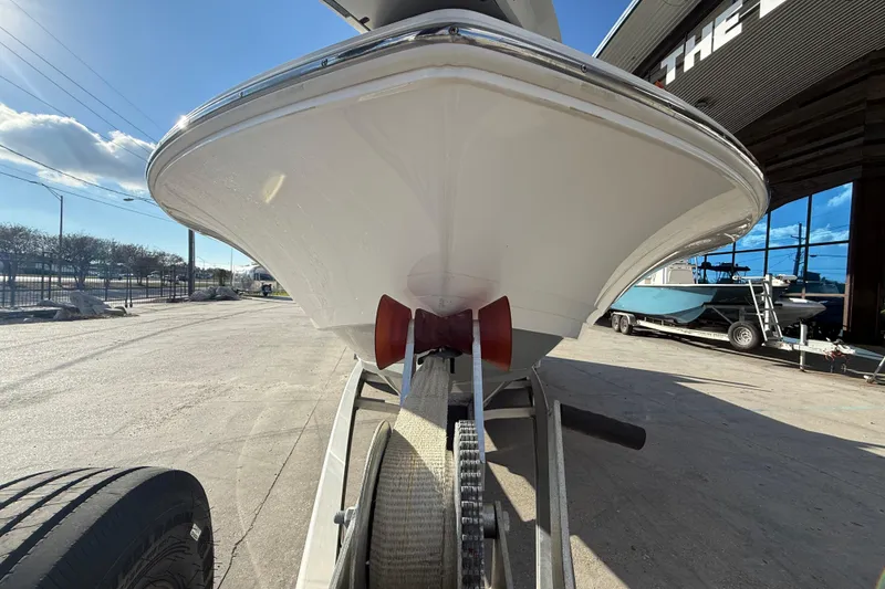 Slide: The Image of 2022 Caymas 28 HB Twin boat on trailer under clear sky. - 3