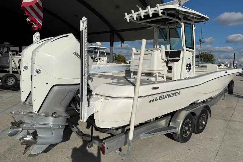 Slide: The Image of 2022 Caymas 28 HB Twin boat interior with modern console and spacious deck. - 7