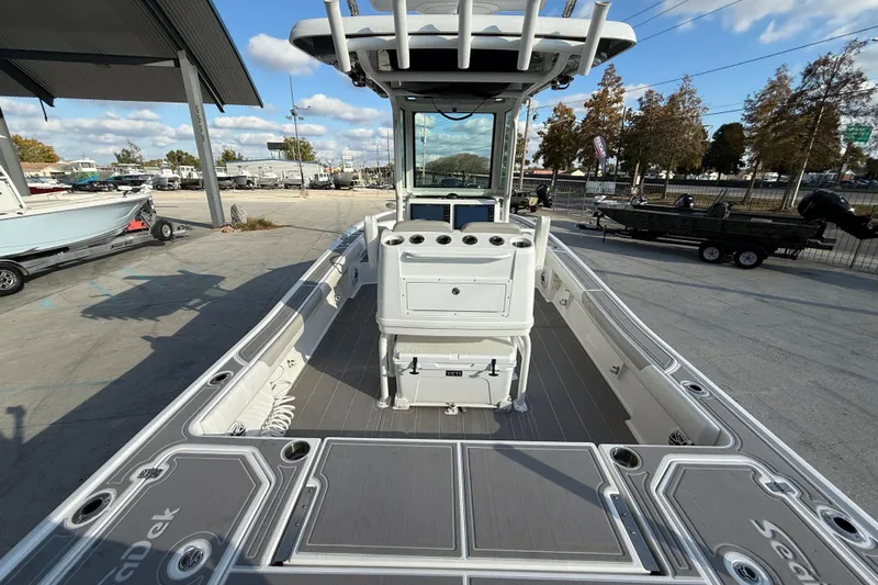 Slide: The Image of 2022 Caymas 28 HB Twin boat interior with modern controls and seating. - 8
