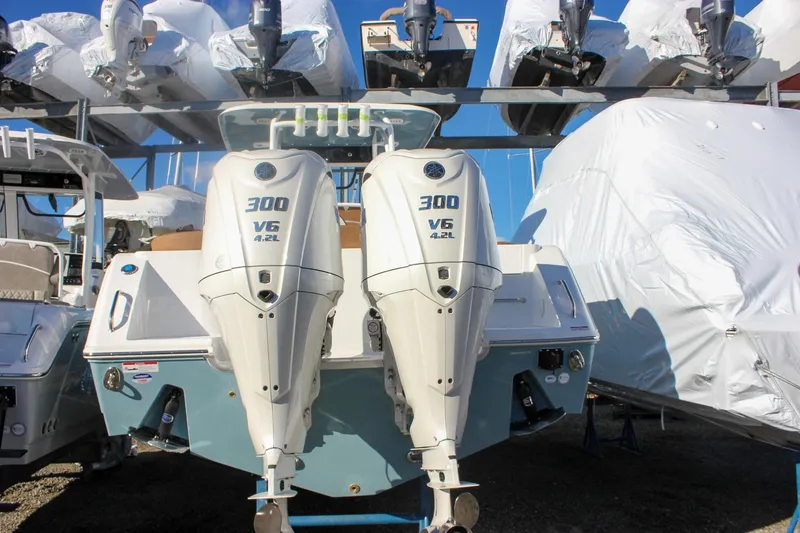 The Image of 2026 Sea Hunt Ultra 285 SE with twin 300 V6 engines in storage. - 0