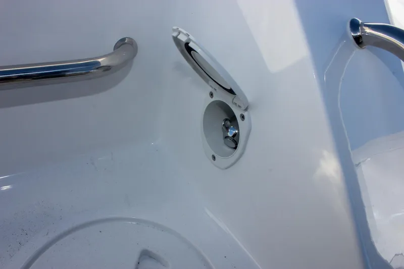 Slide: The Image of 2026 Sea Hunt Ultra 285 SE boat interior detail with stainless steel handle and open compartment. - 12
