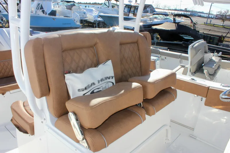 Slide: The Image of Luxurious seating on 2026 Sea Hunt Ultra 285 SE boat, featuring tan leather upholstery. - 23