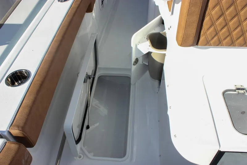 Slide: The Image of Interior view of 2026 Sea Hunt Ultra 285 SE boat with storage compartment. - 29