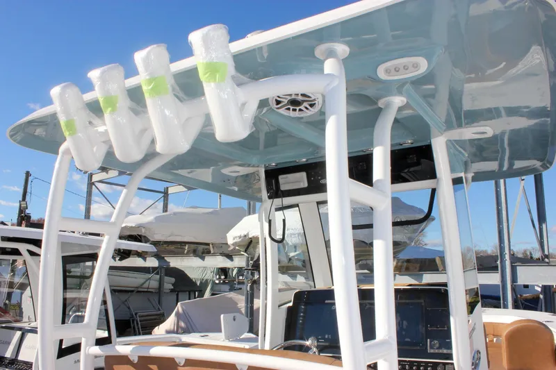 Slide: The Image of 2026 Sea Hunt Ultra 285 SE boat with T-top and rod holders. - 37