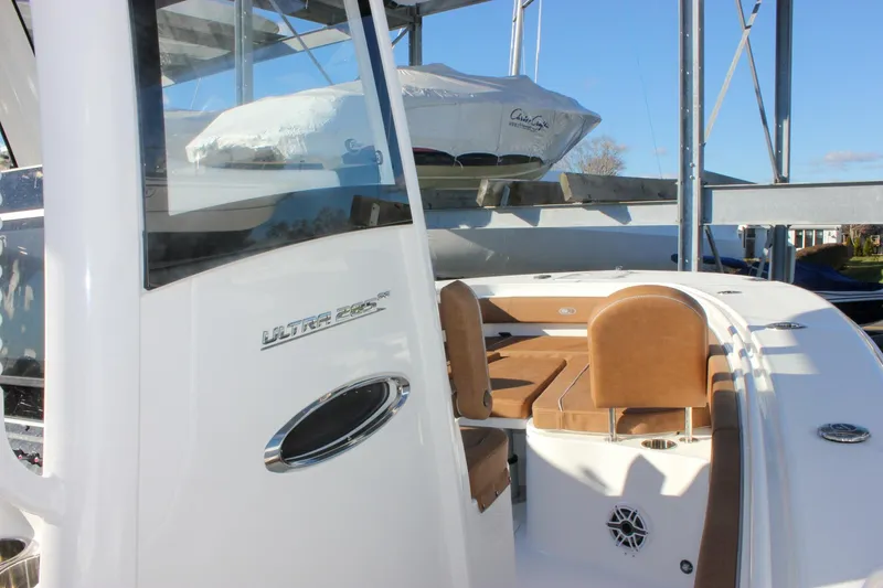 Slide: The Image of 2026 Sea Hunt Ultra 285 SE boat with tan seating and sleek design. - 38