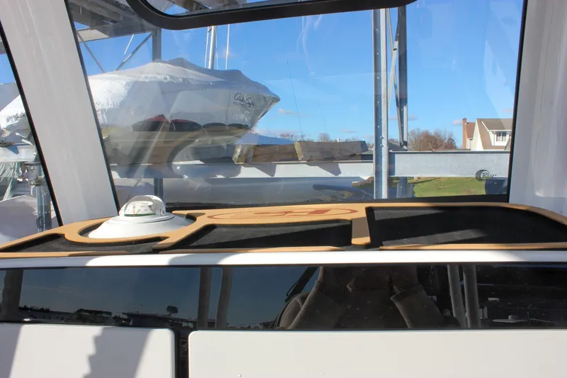 Slide: The Image of Interior view of 2026 Sea Hunt Ultra 285 SE boat with compass and dashboard. - 46