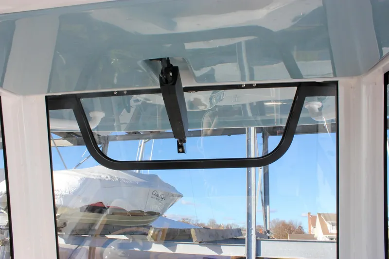 Slide: The Image of 2026 Sea Hunt Ultra 285 SE boat interior with window and blue sky view. - 47