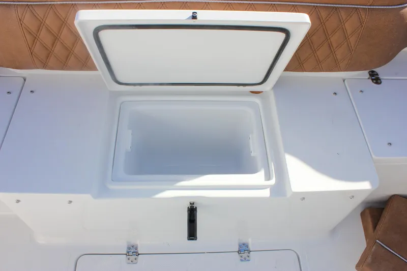 Slide: The Image of Open storage compartment on 2026 Sea Hunt Ultra 285 SE boat. - 53