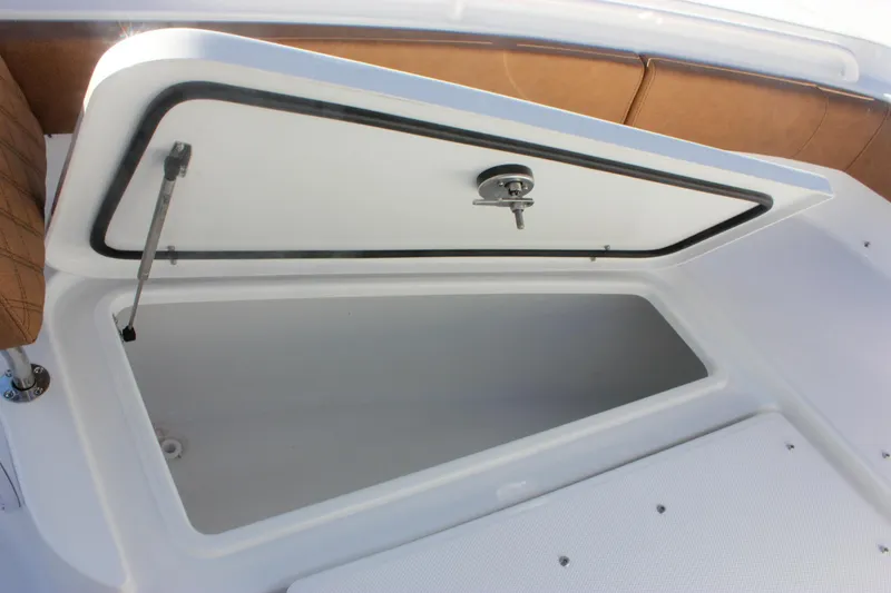 Slide: The Image of Open storage compartment on 2026 Sea Hunt Ultra 285 SE boat. - 59