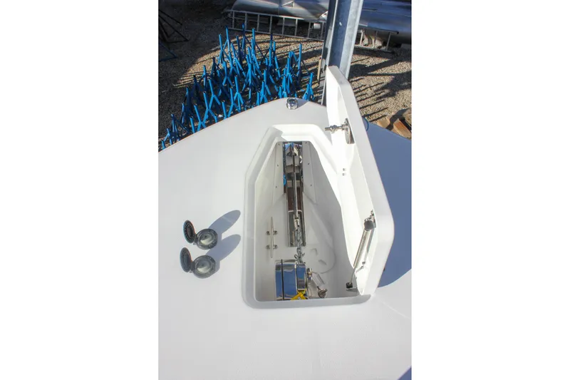 Slide: The Image of Anchor compartment of 2026 Sea Hunt Ultra 285 SE boat, showcasing storage and fittings. - 62