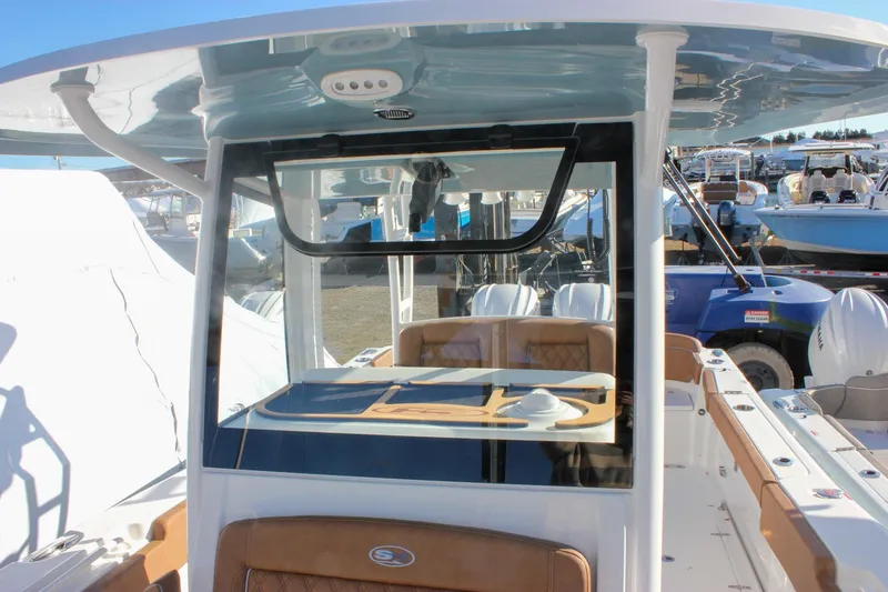 Slide: The Image of 2026 Sea Hunt Ultra 285 SE boat interior with seating and console. - 67