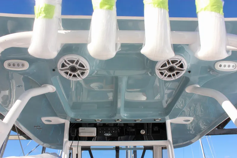 Slide: The Image of 2026 Sea Hunt Ultra 285 SE boat roof with speakers and rod holders. - 69