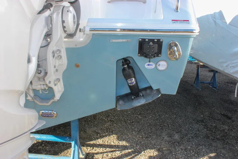 Slide: The Image of 2026 Sea Hunt Ultra 285 SE boat stern with trim tab and hardware. - 7