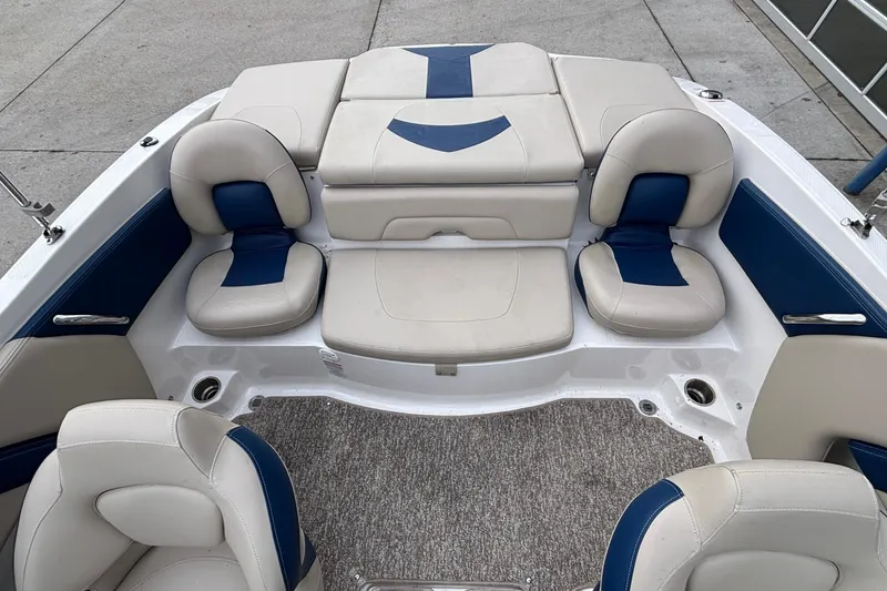 Slide: The Image of 2016 Chaparral 210 Suncoast Ski & Fish boat interior with cushioned seating. - 21