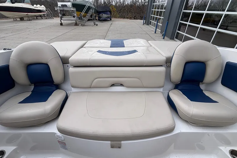 Slide: The Image of 2016 Chaparral 210 Suncoast Ski & Fish boat interior with cushioned seating. - 22