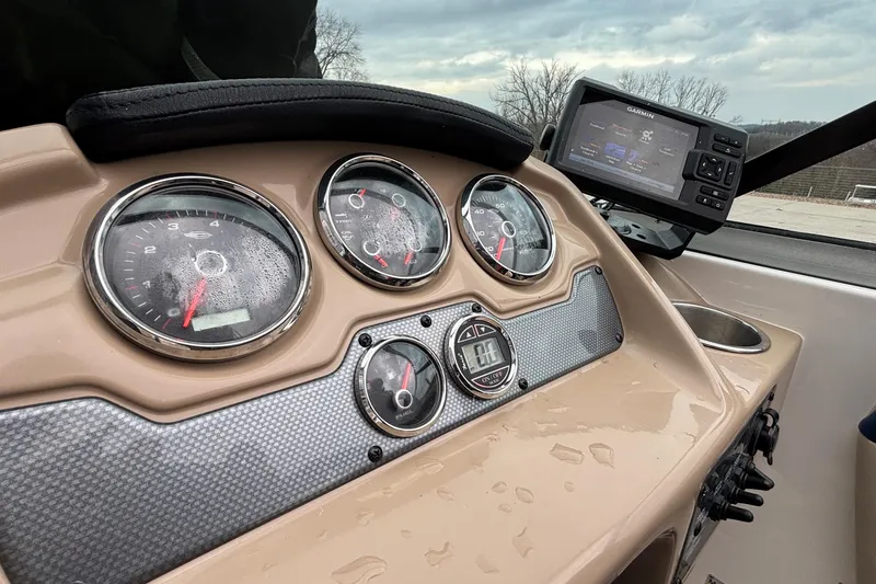 Slide: The Image of Dashboard of 2016 Chaparral 210 Suncoast Ski & Fish with gauges and Garmin display. - 31