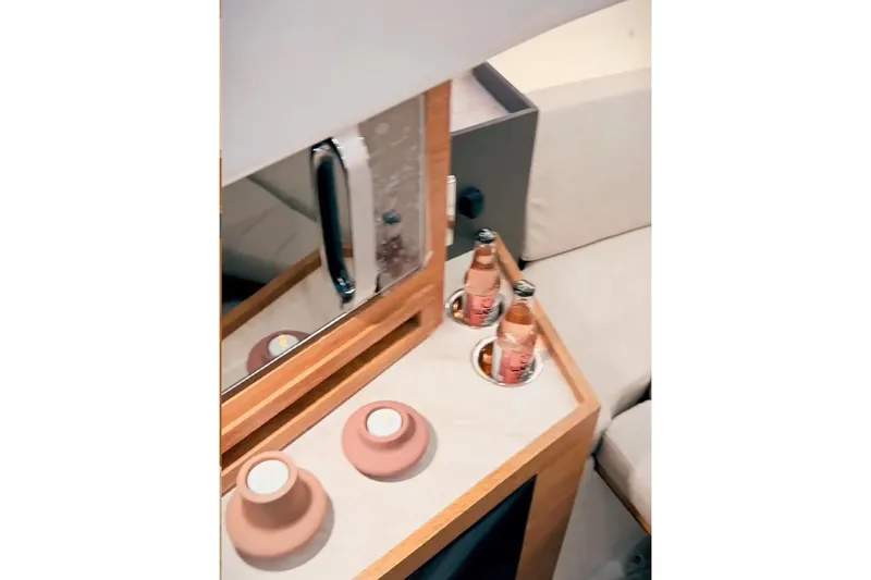 Slide: The Image of Interior of 2026 Granfort 300 GTS yacht with modern seating and sleek design. - 12