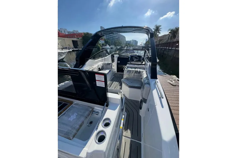 Slide: The Image of Interior view of 2026 Granfort 300 GTS boat, featuring sleek design and modern controls. - 6