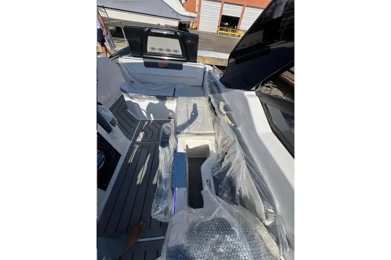 Slide: The Image of Interior of 2026 Granfort 300 GTS boat with blue LED lighting and speakers. - 8